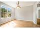 Inviting dining room with hardwood floors and large windows offering scenic views at 619 Rivulett Ct, Lawrenceville, GA 30043