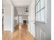 View of the open floor plan, hardwood floors, and fireplace from the home's front entrance at 619 Rivulett Ct, Lawrenceville, GA 30043