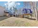 Backyard view featuring multi-level deck, pool and landscaped yard at 8740 Jenkins Rd, Winston, GA 30187