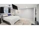 Charming basement bedroom with a ceiling fan, built in shelving, and large TV at 8740 Jenkins Rd, Winston, GA 30187