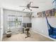 Cozy bedroom featuring a ceiling fan, a bookshelf and space to work from home at 8740 Jenkins Rd, Winston, GA 30187