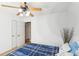 Bright bedroom featuring neutral walls, plush carpet, ceiling fan, and closet at 8740 Jenkins Rd, Winston, GA 30187