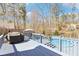 Outdoor deck features a grill, patio furniture, and an inviting above ground swimming pool at 8740 Jenkins Rd, Winston, GA 30187