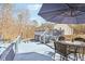 Spacious deck with an umbrella and dining table, perfect for outdoor entertaining and relaxing at 8740 Jenkins Rd, Winston, GA 30187
