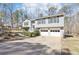 Two-story home with a two-car garage and landscaped front yard at 8740 Jenkins Rd, Winston, GA 30187