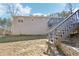 Exterior of the home showing siding and access to the outdoor deck and yard at 8740 Jenkins Rd, Winston, GA 30187