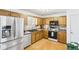 Kitchen featuring stainless steel appliances, wood cabinets, and plenty of counter space at 8740 Jenkins Rd, Winston, GA 30187