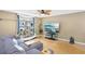 Cozy living room with a neutral color scheme, hardwood floors, sectional couch, and a large entertainment center at 8740 Jenkins Rd, Winston, GA 30187
