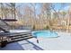 Outdoor deck with a built-in above ground swimming pool, ideal for summer fun at 8740 Jenkins Rd, Winston, GA 30187