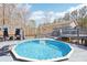 Relaxing backyard pool with deck, pergola, and charming home exterior at 8740 Jenkins Rd, Winston, GA 30187