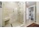Elegant bathroom features a glass enclosed shower with a built-in seat and handrails at 195 14Th Ne St # Ts8, Atlanta, GA 30309