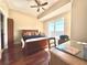 Bright bedroom features hardwood floors, a ceiling fan, and balcony access at 195 14Th Ne St # Ts8, Atlanta, GA 30309