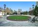 Relaxing common green space with seating, decorative lighting, and well maintained landscaping at 195 14Th Ne St # Ts8, Atlanta, GA 30309