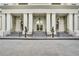 Grand entrance featuring white columns, manicured topiaries, and steps leading to the door at 195 14Th Ne St # Ts8, Atlanta, GA 30309