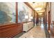 Beautiful hallway with wood paneling, a decorative console table, and elegant lighting at 195 14Th Ne St # Ts8, Atlanta, GA 30309