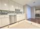 Efficient kitchen features stainless steel appliances, white cabinetry, and stylish backsplash at 195 14Th Ne St # Ts8, Atlanta, GA 30309
