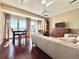 Sunlit living room showcasing hardwood floors, dining area and views from large windows at 195 14Th Ne St # Ts8, Atlanta, GA 30309