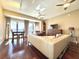 Bright living room with hardwood floors, ceiling fan, and floor-to-ceiling windows at 195 14Th Ne St # Ts8, Atlanta, GA 30309