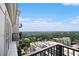 Breathtaking view from the balcony showcasing lush greenery and serene lake at 195 14Th Ne St # Ts8, Atlanta, GA 30309