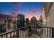 City skyline view from balcony, showcasing surrounding buildings, and a colorful dusk sky at 195 14Th Ne St # Ts8, Atlanta, GA 30309