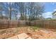 Fenced backyard with stepping stones, providing a private outdoor area at 2322 Coach Way, Jonesboro, GA 30236