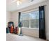 Bright bedroom with large windows and neutral walls, offering a serene and inviting atmosphere at 2322 Coach Way, Jonesboro, GA 30236