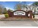 Welcoming community sign 'Carriage Place' set against a backdrop of beautifully landscaped grounds at 2322 Coach Way, Jonesboro, GA 30236
