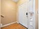 Entryway with wood-look flooring, coat hooks, and a sidelight window next to the front door at 2322 Coach Way, Jonesboro, GA 30236