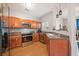 Kitchen showcasing stainless steel appliances, wood cabinets and plenty of natural light at 2322 Coach Way, Jonesboro, GA 30236