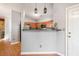 Kitchen features stainless steel appliances, wood cabinets, and hardwood flooring at 2322 Coach Way, Jonesboro, GA 30236