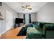 Open-concept living room boasts natural light, hardwood floors, and modern gray paint at 2322 Coach Way, Jonesboro, GA 30236