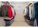 A fully organized walk-in closet offers ample storage with lots of space for hanging clothes at 2322 Coach Way, Jonesboro, GA 30236