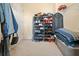 Efficient walk-in closet with shelving for shoe storage and ample space for organization at 2322 Coach Way, Jonesboro, GA 30236