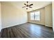 Bright bedroom with large window, ceiling fan, and neutral color scheme for relaxation at 2795 Greenbridge Drive, Norcross, GA 30071