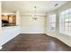 Elegant dining room area with chair rail molding, hardwood floors, and abundant sunlight at 2795 Greenbridge Drive, Norcross, GA 30071