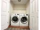 This laundry room features a modern washer and dryer and storage space at 2795 Greenbridge Drive, Norcross, GA 30071