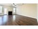 Spacious living room with hardwood floors, a cozy fireplace, and ample natural light at 2795 Greenbridge Drive, Norcross, GA 30071