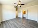 Serene main bedroom boasts a ceiling fan, an en-suite bathroom, and hardwood floors at 2795 Greenbridge Drive, Norcross, GA 30071