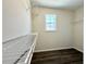 Walk-in closet with built-in shelving and hardwood floors, providing ample storage at 2795 Greenbridge Drive, Norcross, GA 30071