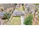 Aerial view of the home showcasing its roof, driveway, and surrounding landscaping and neighborhood at 3081 Oak Dr, Lawrenceville, GA 30044
