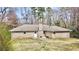 Expansive backyard with lush green space and mature trees, perfect for outdoor activities at 3081 Oak Dr, Lawrenceville, GA 30044