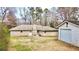 Spacious backyard featuring a detached garage and mature landscaping at 3081 Oak Dr, Lawrenceville, GA 30044