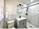 Renovated bathroom featuring a new vanity, black fixtures, and a walk-in shower at 3081 Oak Dr, Lawrenceville, GA 30044