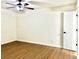 Bedroom featuring light wood flooring, white walls, and a ceiling fan at 3081 Oak Dr, Lawrenceville, GA 30044