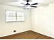 Bedroom featuring light wood flooring, white walls, one window, and a ceiling fan at 3081 Oak Dr, Lawrenceville, GA 30044