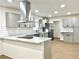 Modern kitchen with stainless steel appliances, white countertops, and gray cabinets at 3081 Oak Dr, Lawrenceville, GA 30044