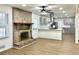 Living Room with brick fireplace and updated kitchen with new appliances at 3081 Oak Dr, Lawrenceville, GA 30044