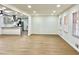 Bright living room featuring hardwood floors, modern lighting, and an open layout to the kitchen at 3081 Oak Dr, Lawrenceville, GA 30044