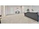 Spacious basement with a football decor and barstool at 135 Eastmark Way, Fayetteville, GA 30214
