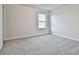 Bedroom featuring neutral paint, carpeting, and a window at 135 Eastmark Way, Fayetteville, GA 30214